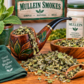 Mullein pipe filled with dried mullein leaves with a pile of dried mullein ready to fill more pipes
